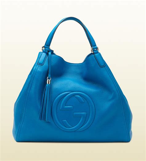 blue gucci soho bag.